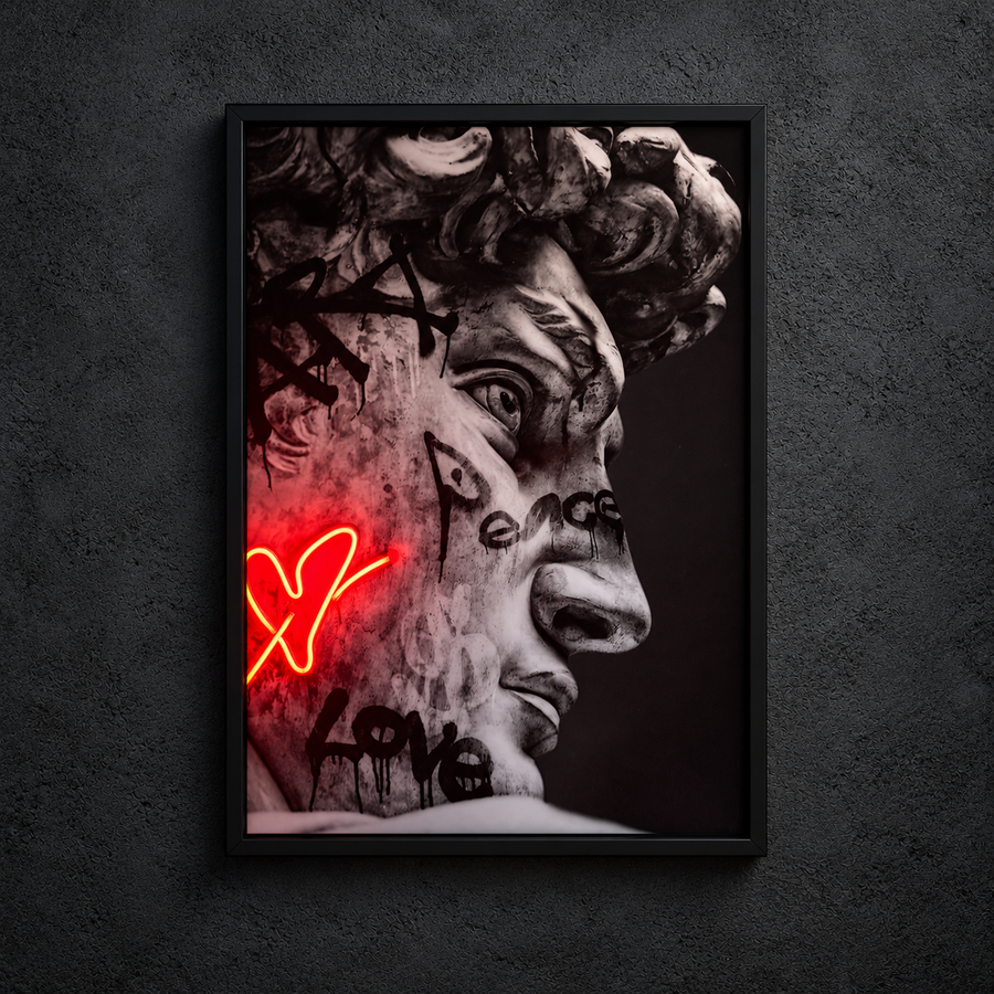 Framed David Art love artwork showing a graffiti-covered classical face in profile with a small heart, with a red heart illuminated.